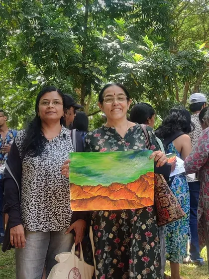 Two artists proudly showing their work. It is a wonderful feeling to create something beautiful with your own hands.