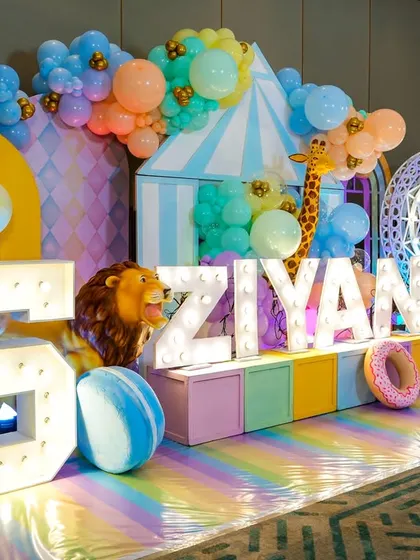 Another angle of the stunning pastel carnival stage, showcasing the light-up '5' and 'Ziyan' letters.