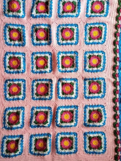 The full Lydia blanket laid out, showcasing the complete pattern of 20 floral squares. This was a true labor of love and a joy to create.