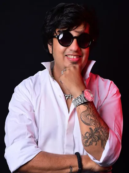 A close-up shot showing my tattoo and confident smile. This is the persona I bring to my DJ booth every night.
