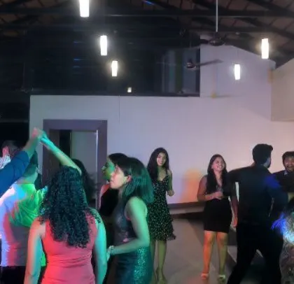 A candid shot of the happy guests dancing.