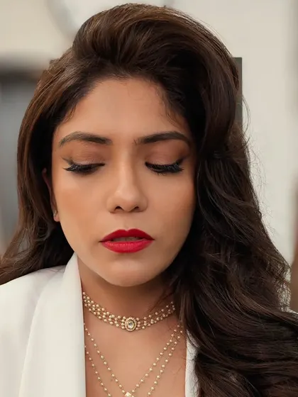 A close-up showing the flawless eye makeup. The winged liner is sharp, and the eyeshadow is blended perfectly for a sophisticated finish.