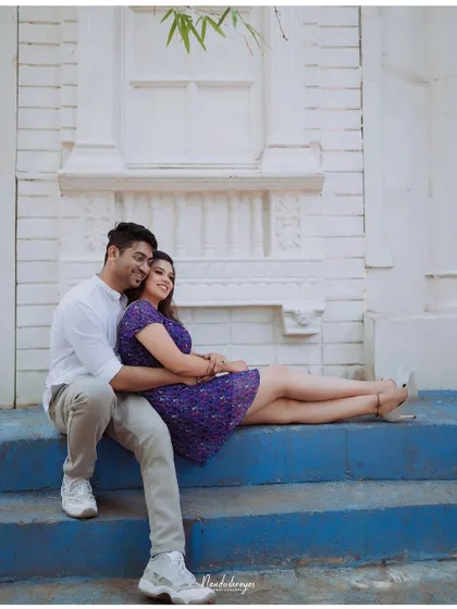 A relaxed and loving pose on the blue steps of our Santorini-inspired set.