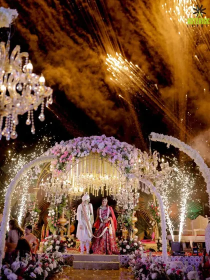 Under a sky full of fireworks and a canopy of florals, we craft the perfect 'I do' moment. This is where your forever begins, lit up by love and a touch of our signature magic.