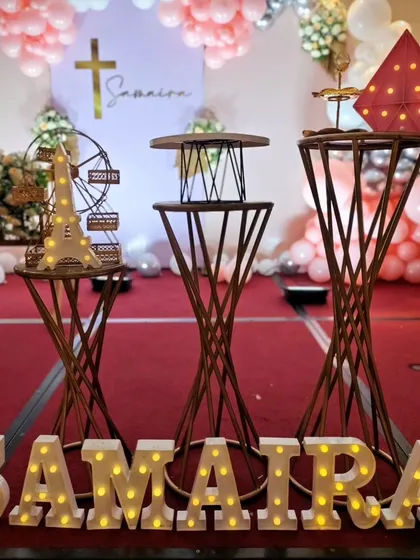 A close-up of the decor details, including light-up letters and an Eiffel tower prop.
