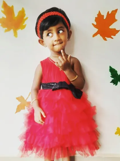 Another adorable pose from Pari. I focus on creating kids' party dresses that are not only beautiful but also allow them to move, play, and express their personalities.