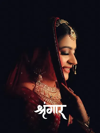 A profile portrait of bride Nikita, her smile and traditional 'Shringaar' captured in a timeless frame.