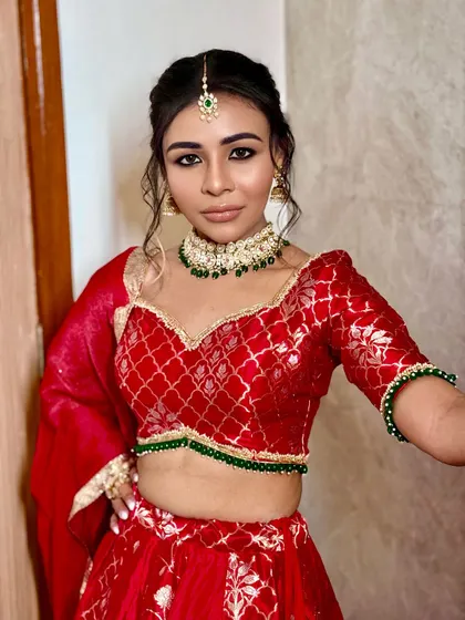 A close-up of the bold and beautiful makeup for the Mata Ki Chowki. The smoky eye and defined features create a powerful and devotional look.