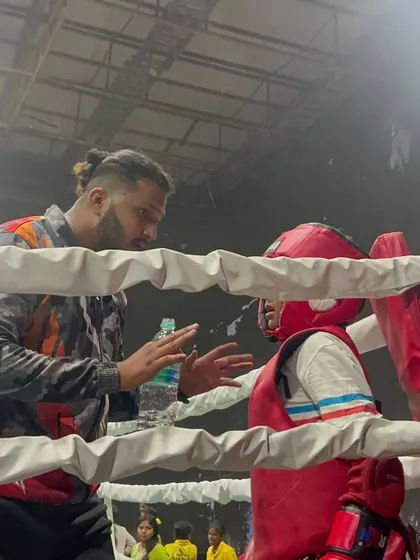 In the heat of competition, guidance is everything. I am in my fighter's corner during the IFMA National Championships, making sure they are focused, hydrated, and ready for the next round.