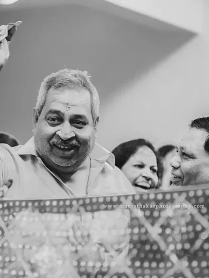 The same joyful family moment, presented in timeless black and white to emphasize the emotion and expression.