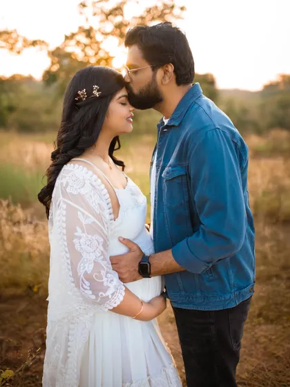 Capturing the quiet, intimate moments between partners is one of my favorite things. This golden hour pregnancy photo shows a tender kiss, highlighting the love and connection that started it all.