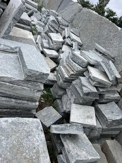 A mix of different sized Narasapura stones, available for creating varied and natural-looking paved surfaces.