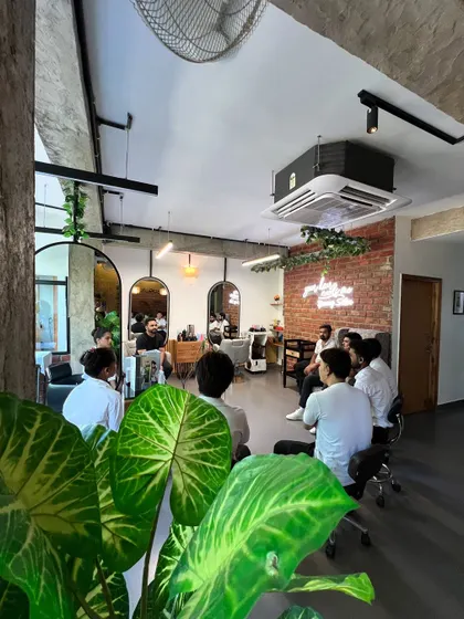 A training session in progress. Continuous education is key to our success, ensuring my team is always up to date on the latest hair color and styling techniques.