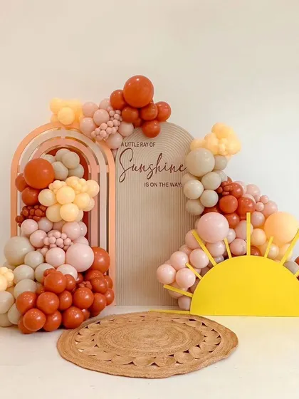The full "Little Ray of Sunshine" setup, complete with a sun cutout and a jute rug. The warm, happy colors are perfect for celebrating a new arrival.