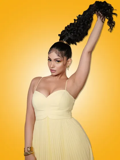A confident pose from our "Summer Edit" model, showing off her hairstyle and the overall glamorous vibe of the campaign.