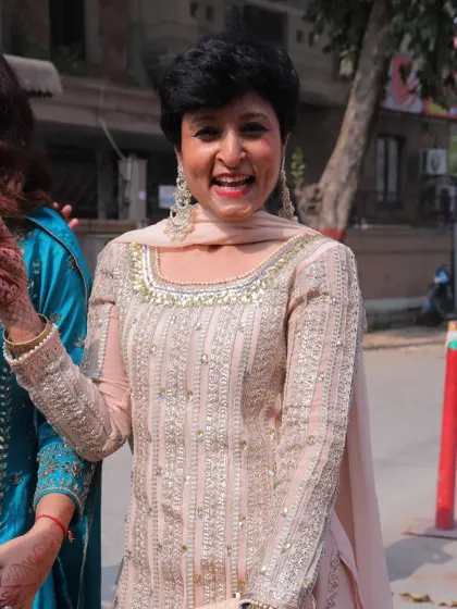 A candid moment of joy at a family function. My goal is to help women feel this happy and vibrant in their own skin.