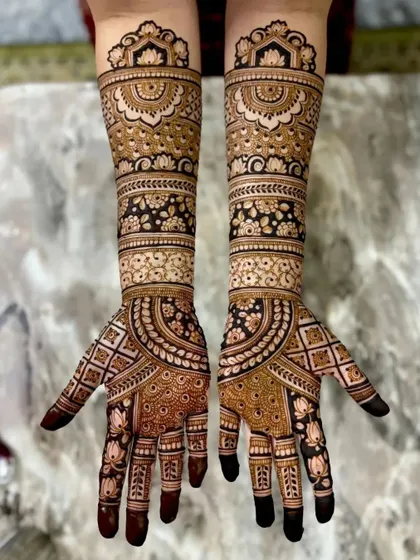 A detailed bridal design with a mix of floral, paisley, and geometric elements. The full coverage is perfect for a grand celebration.