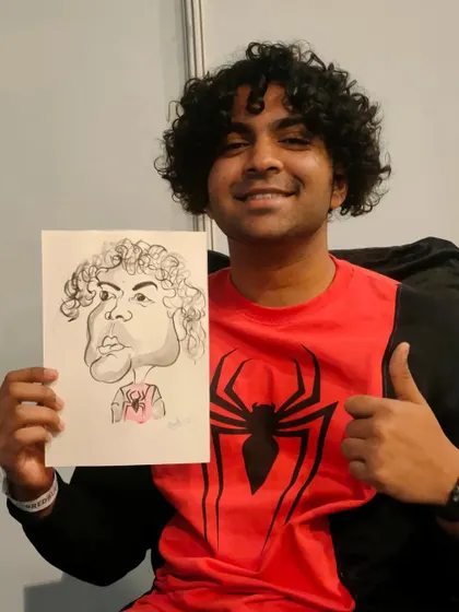 This guest's Spiderman shirt even made it into his caricature. It's all about the fun details.