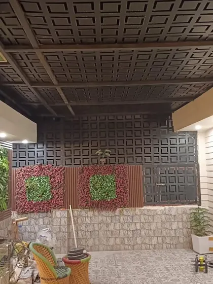 The finished look of the Najafgarh project with its unique laser-cut screens and vertical garden panels.