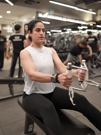 This client is focused during a seated cable row, an exercise that is excellent for building thickness and strength in the middle back.