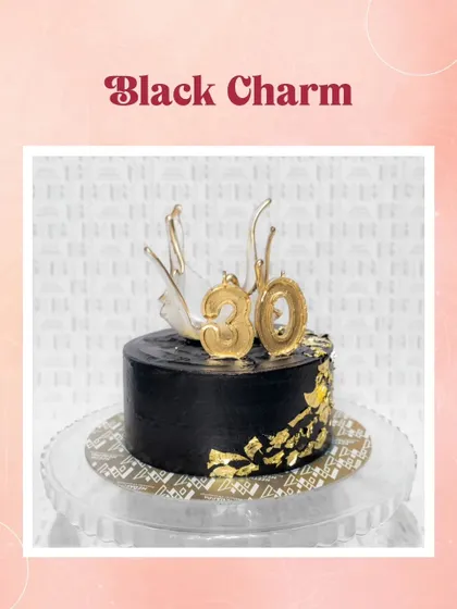 Black charm. A sophisticated black cake for a 30th birthday, decorated with gold leaf and a dramatic white chocolate splash.