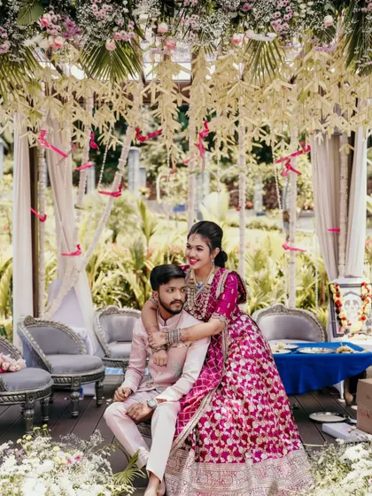 The bride lovingly places her arm around the groom in this sweet engagement portrait.
