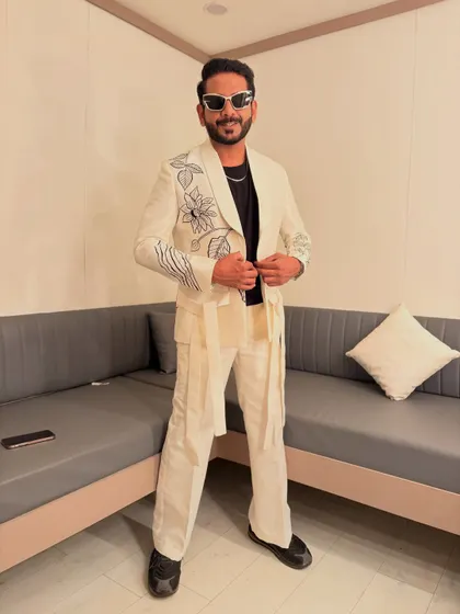 A full-length view of my white embroidered suit, paired with modern cargo-style pants. It's all about blending classic style with fresh trends.