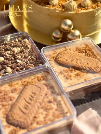 An assortment of my dessert boxes. Here you can see my Lotus Biscoff tubs and a chocolate crumble dessert, ready to be picked up and enjoyed.