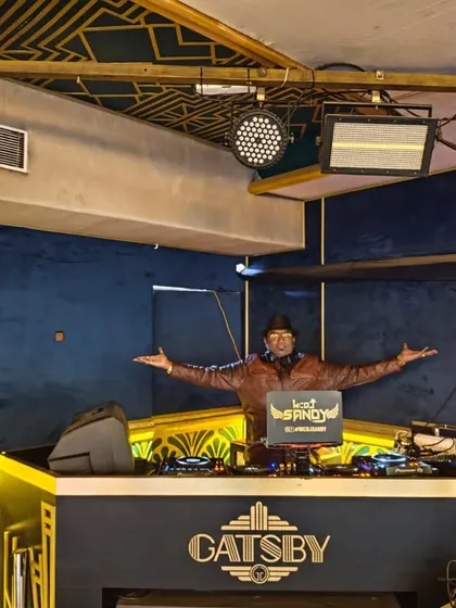 Posing at my DJ booth at the Gatsby before the party started. I was ready to bring the energy for a corporate book launch and Founder's Day celebration.