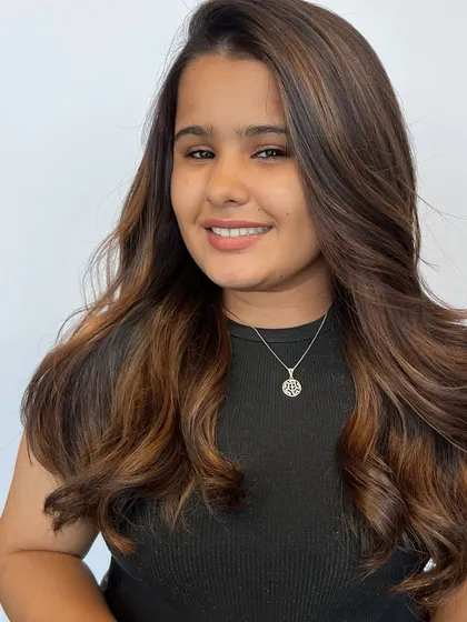 A smiling client happy with her new Matryoshka balayage hair color. Seeing our clients and students happy is the most rewarding part of my job.