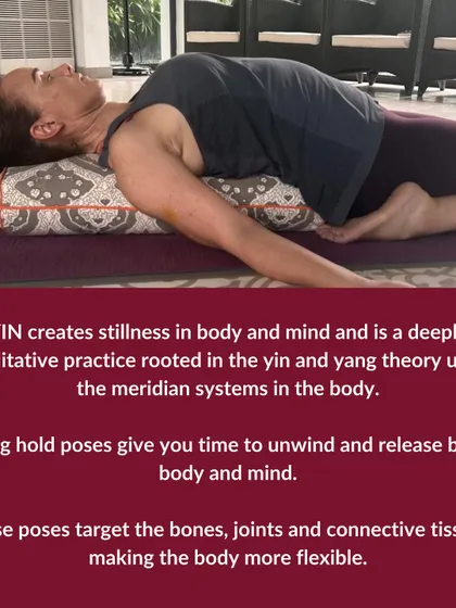 A student in a supported reclining pose. Yin Yoga creates stillness in both body and mind. These long-held poses give you time to unwind and release, targeting bones, joints, and fascia.
