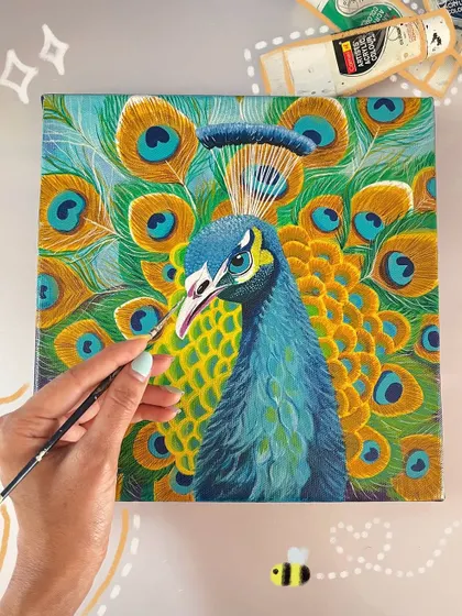 Here, I'm adding the final touches to a vibrant peacock portrait. This flat-lay view shows the rich texture of the canvas and the bright acrylic paints I use to bring the bird's character to life.