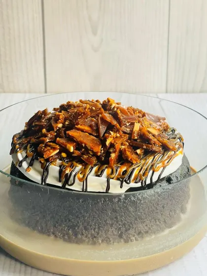 This is my Mocha Caramel Almond Praline Tres Leches. The combination of coffee, gooey caramel, and crunchy almond praline makes every bite a magical experience.