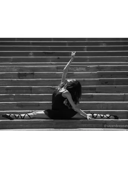 Another variation of the split, showing the strength and control that comes from years of dedicated practice and training.