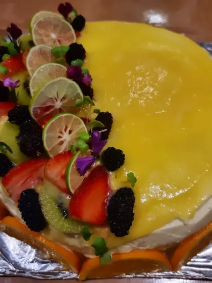 Our chilled cheesecake has kagzi lemon curd across the top, with strawberries, mulberries and kiwi arranged along one side.