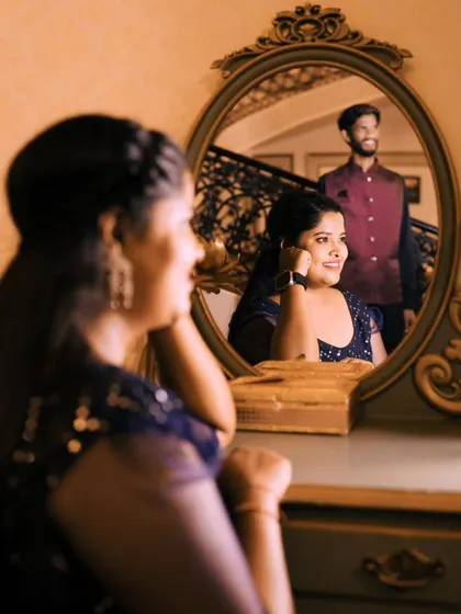 Another artistic mirror shot, this time focusing on the bride-to-be's reflection as her partner looks on. It tells a beautiful story.