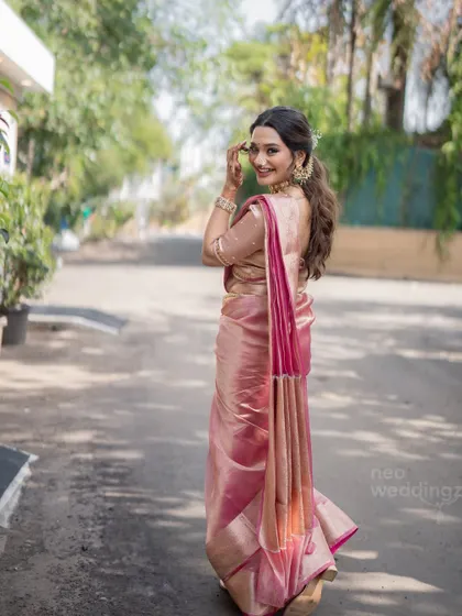 A playful glance over the shoulder. The makeup looks great from every angle.