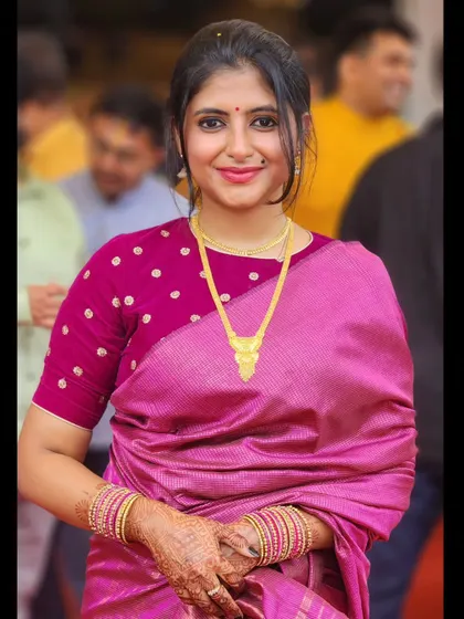 A happy close-up in a pink saree, a look I call 'Pink Pushpavathi'.