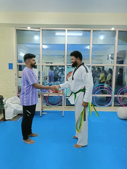 A handshake between students and coaches.