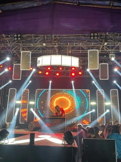 Owning a massive stage setup. I am experienced in performing at large scale outdoor events with complex sound and light arrangements.