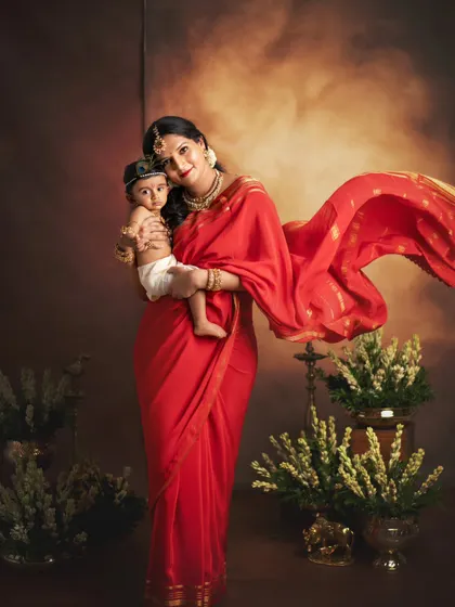 Another variation of the Yashodha and Krishna theme, with the mother's red saree flowing beautifully. This portrait captures the grace and love of motherhood.