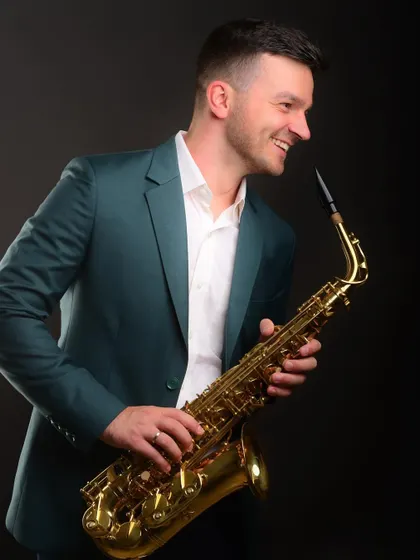 Incorporating a personal talent, like playing the saxophone, into a professional shoot adds a memorable and unique dimension to a personal brand.