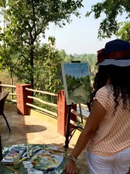 I find my greatest inspiration in nature. This is me in my element, painting a landscape outdoors, capturing the light and feeling of a place. This connection to the natural world is at the core of my artistic process.
