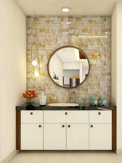 This design features a wash basin in the foyer area, set against a beautiful stone-clad wall. The cabinet below provides storage, making it a practical addition for guests.