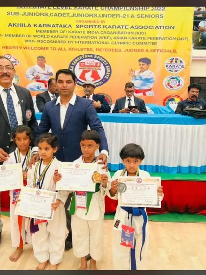 Anya, one of our promising young students, on the podium after winning a bronze medal in the 7 years category.