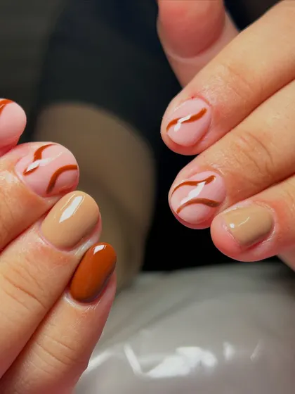 For the love of browns and curves. This set features a mix of solid brown shades and abstract swirl designs on a nude base.