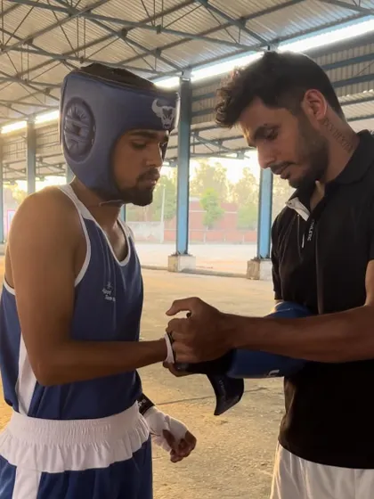 Pre-fight ritual. I'm wrapping my student's hands before his bout at the 2nd Open National Championships in Panipat. Focus and preparation are everything.