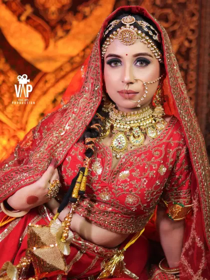 A stunning close-up of a bride wearing one of our most detailed Rajwada sets. Notice the craftsmanship in the oversized necklace, the delicate nath, and the elaborate matha patti, all designed for a royal look.
