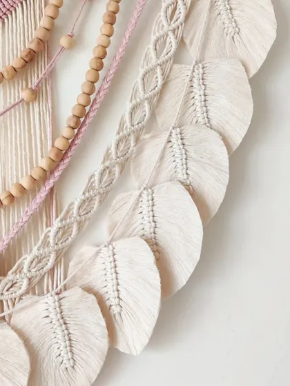 A close-up of the perfectly crafted macrame leaves.
