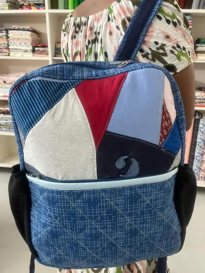 A client modeling the custom-made memory backpack.